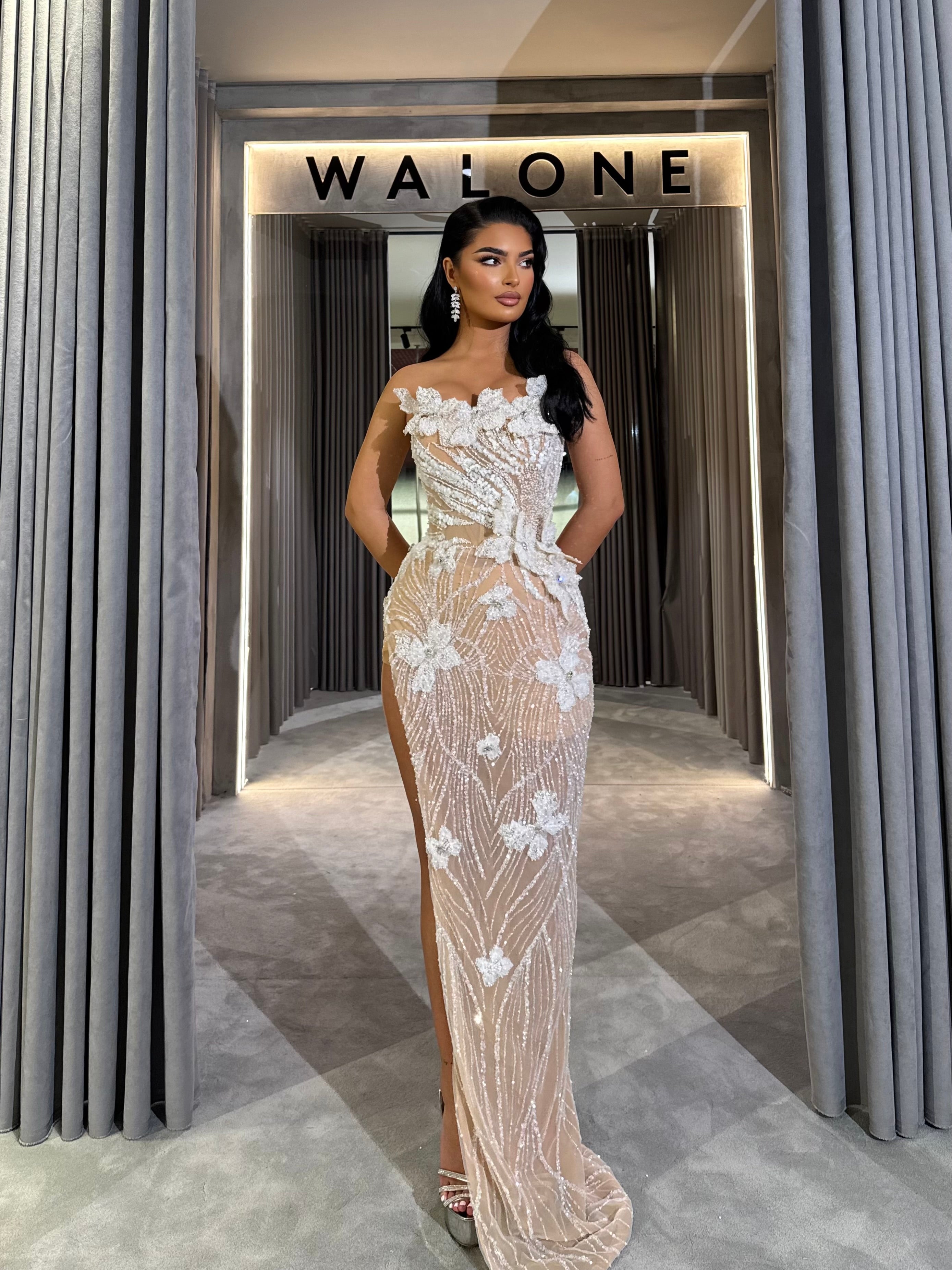 Long dress with 3D floral appliqués and sheer crystal detailing