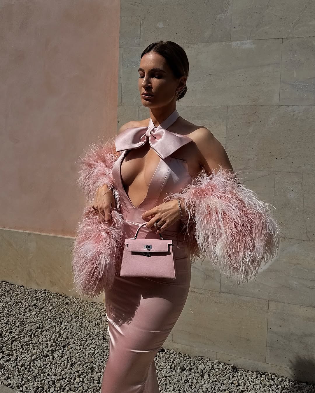 Lena Terlutter - Pink Halter Gown with Bow and Feather Sleeves