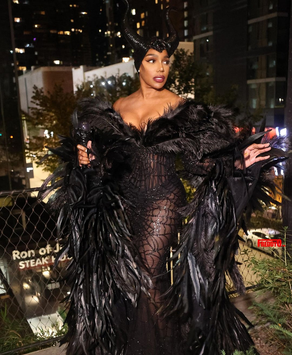 NENE LEAKES - Black feathered gown
