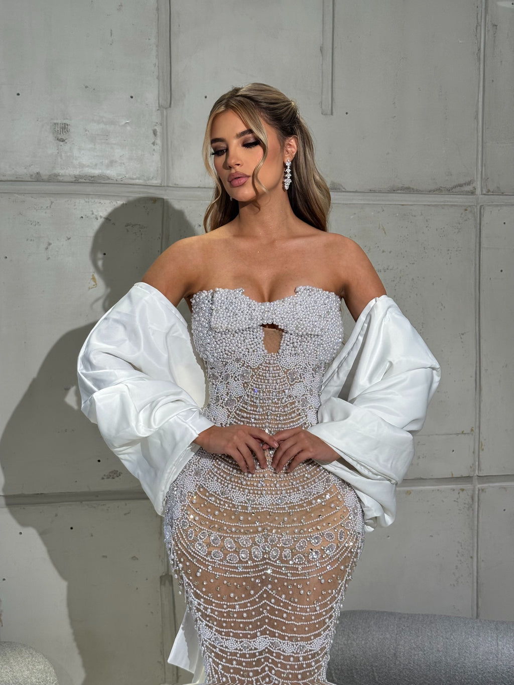 Strapless bridal Gown with pearls and detachable cape sleeve