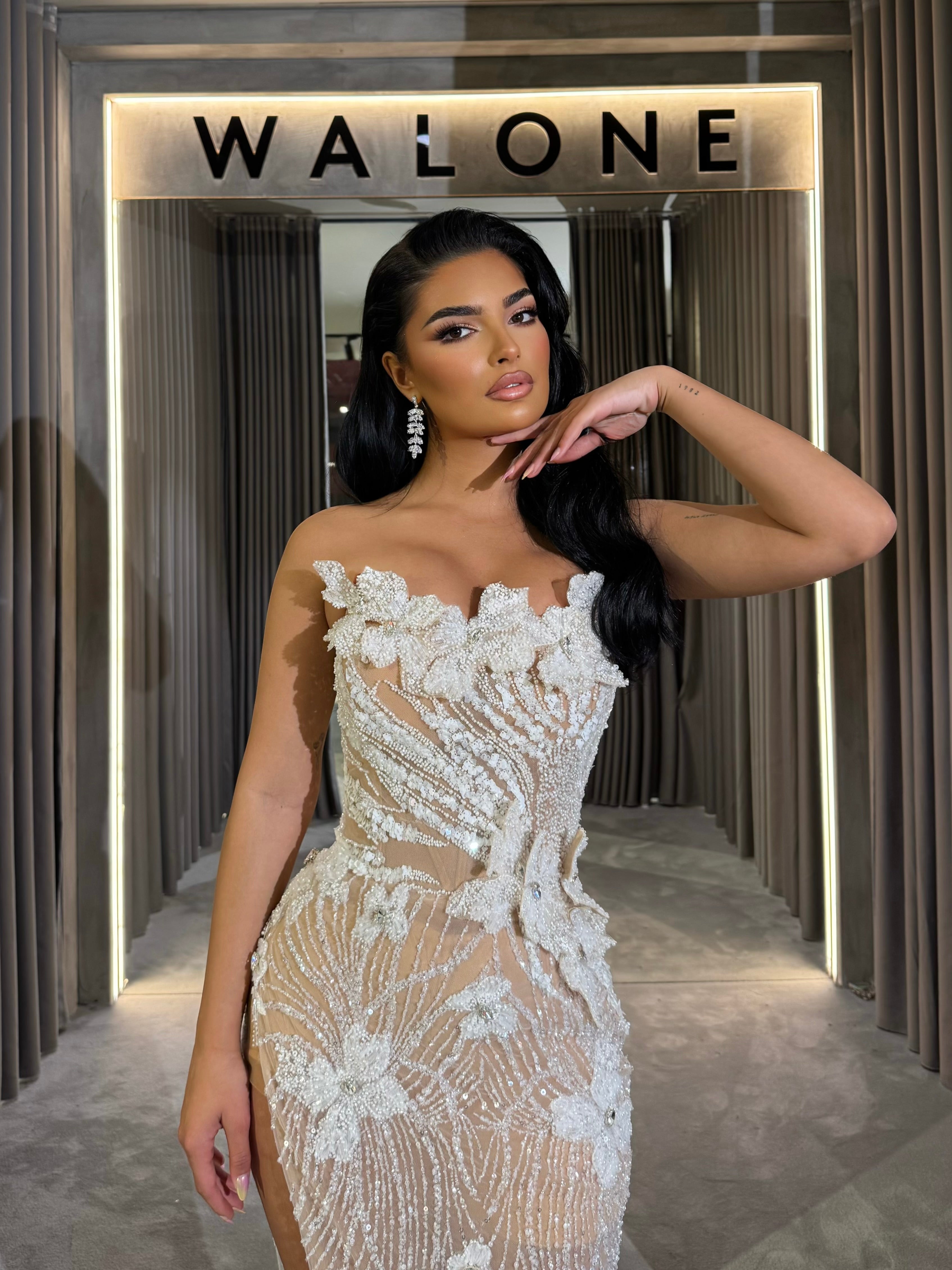 Long dress with 3D floral appliqués and sheer crystal detailing