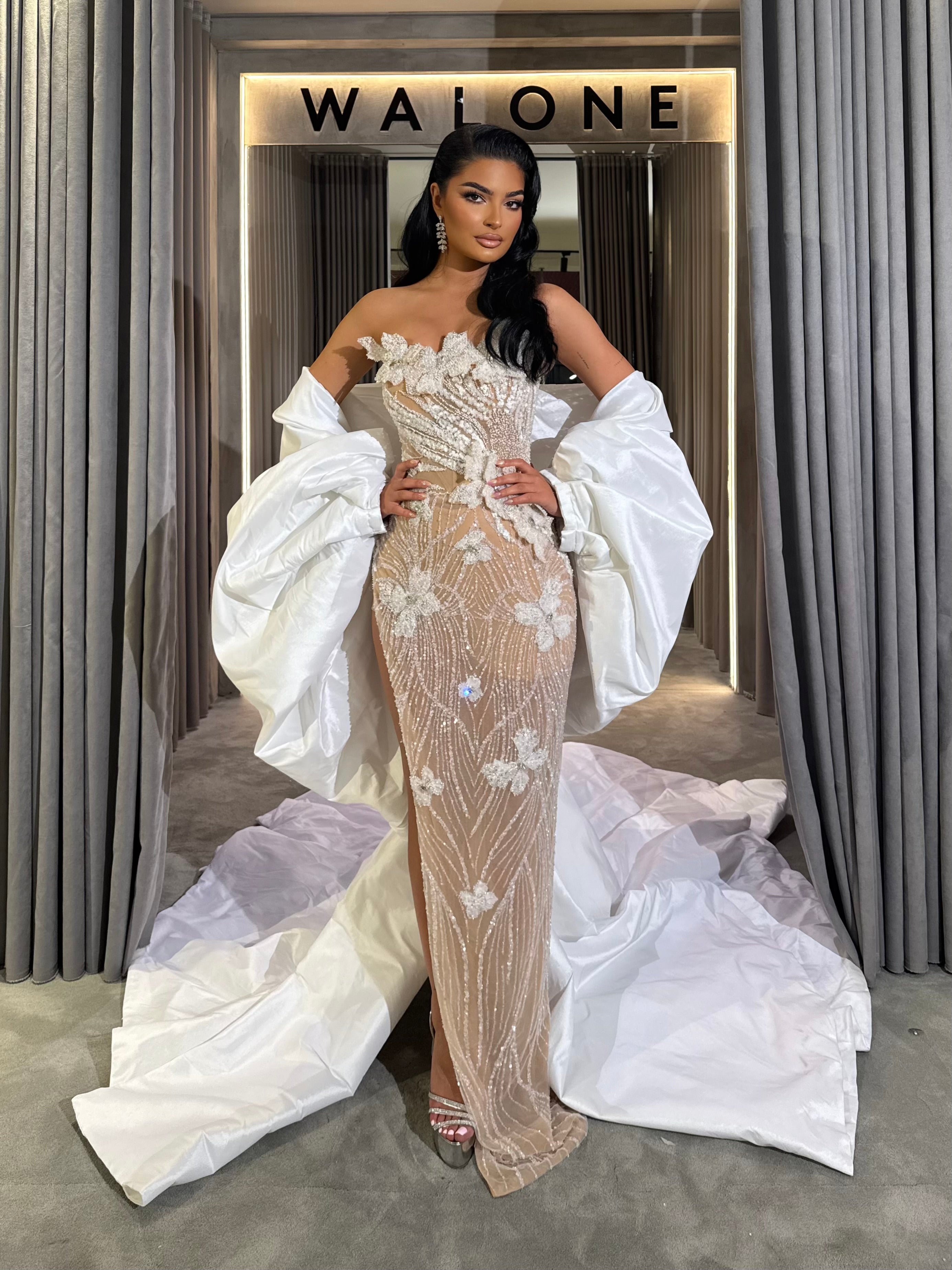 Long dress with 3D floral appliqués and sheer crystal detailing