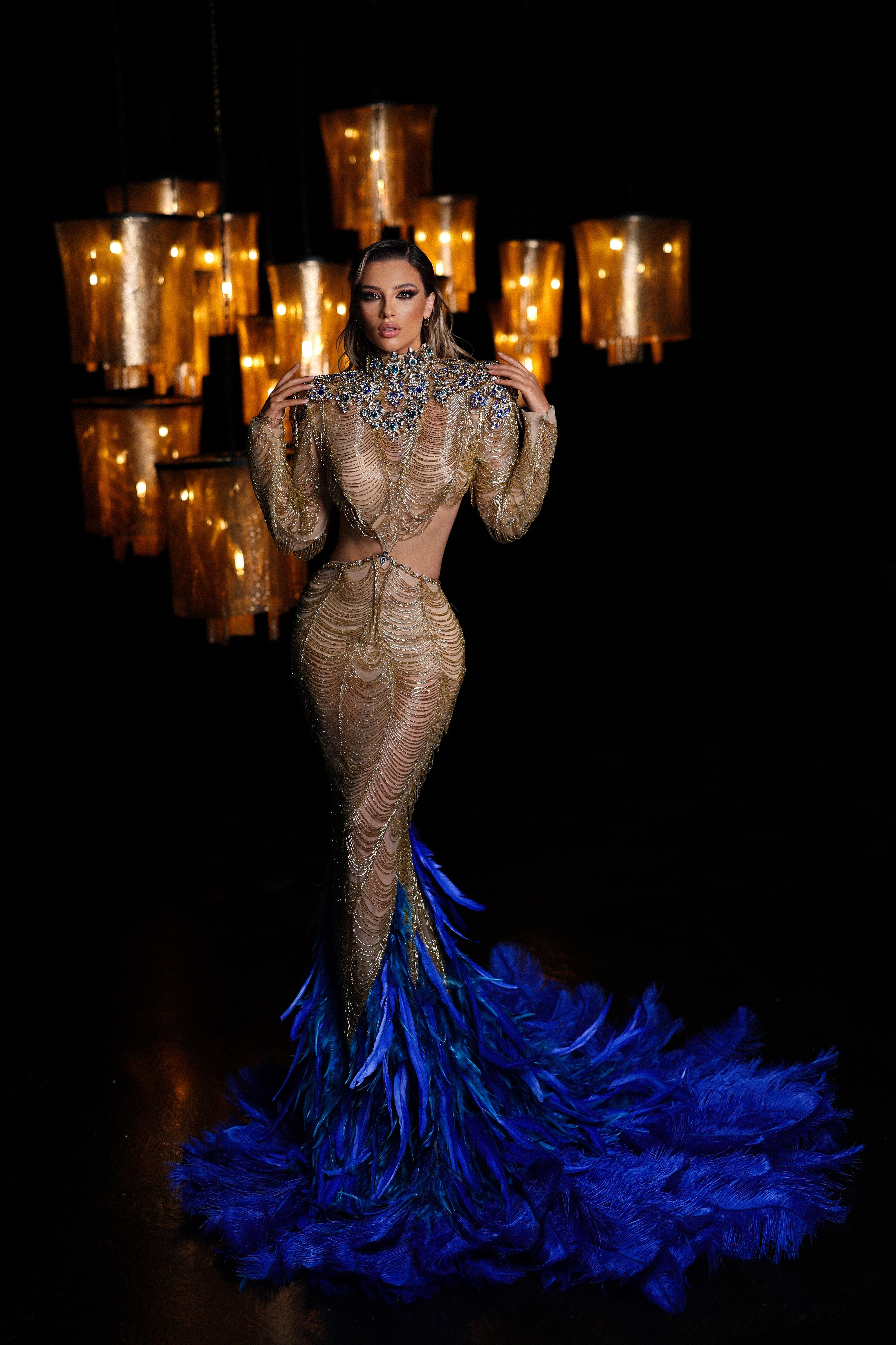 High Neck Gold Tassel Gown with Blue Feathered Train